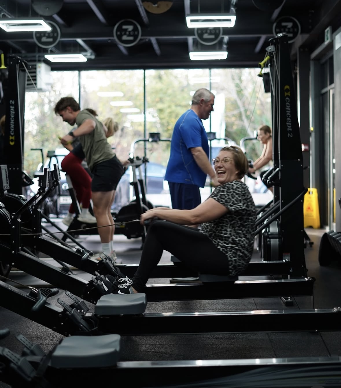 Members on rowing machines